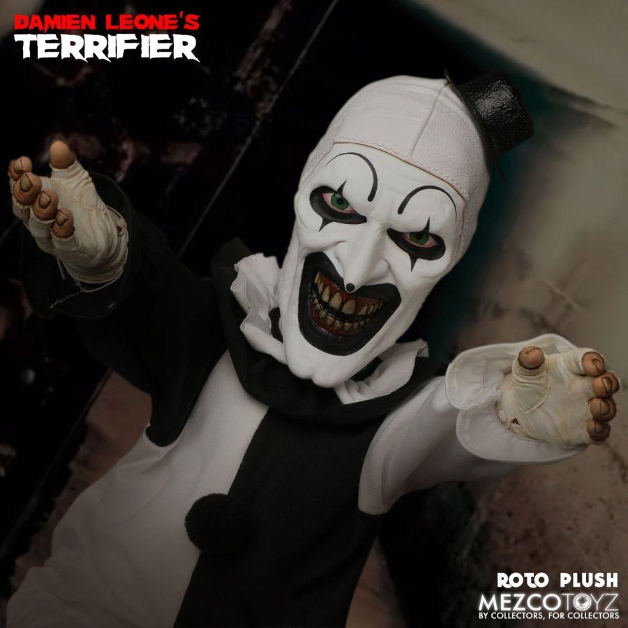 MEZ25526 Terrifier - Art The Clown 18'' Roto Plush - Mezco Toyz - Titan Pop Culture